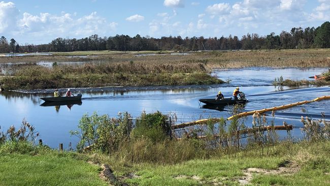 Environmental specialists install curtain to protect water quality. Photo uploaded on Sept. 23, 2018.