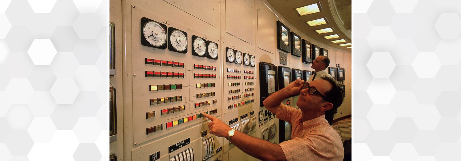 Who are these men in the control room?