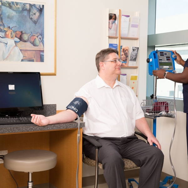Male patient BP check by nurse