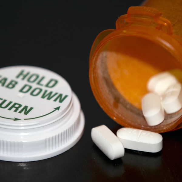 Prescription_Drug_Bottle_open_with_pills_closeup