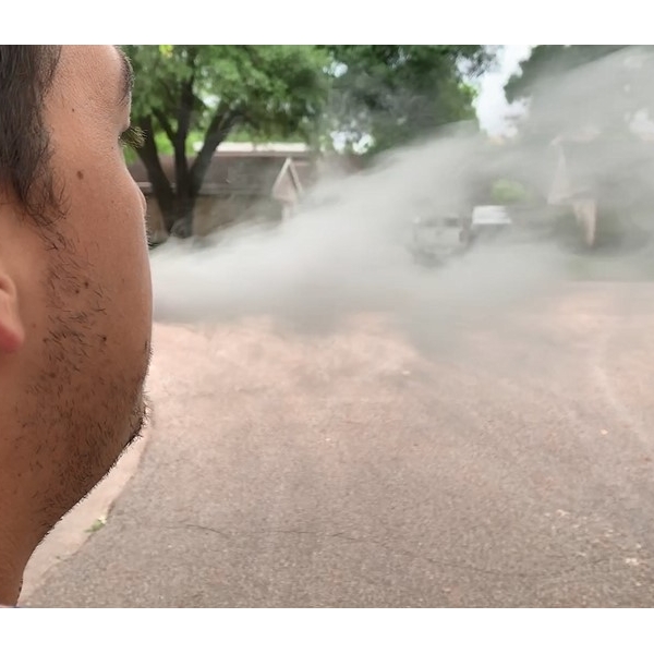 Man+blowing+e-cigarette+vapor