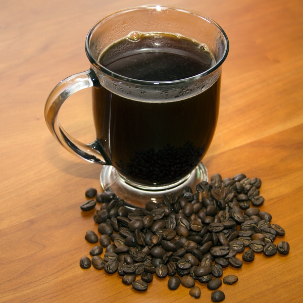 Coffee+in+Cup+with+whole+beans+Horizontal