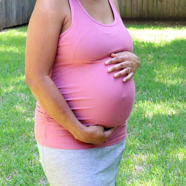 Mom+holding+baby+bump