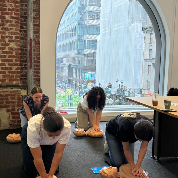 NWSL+participants+practicing+hands-only+CPR