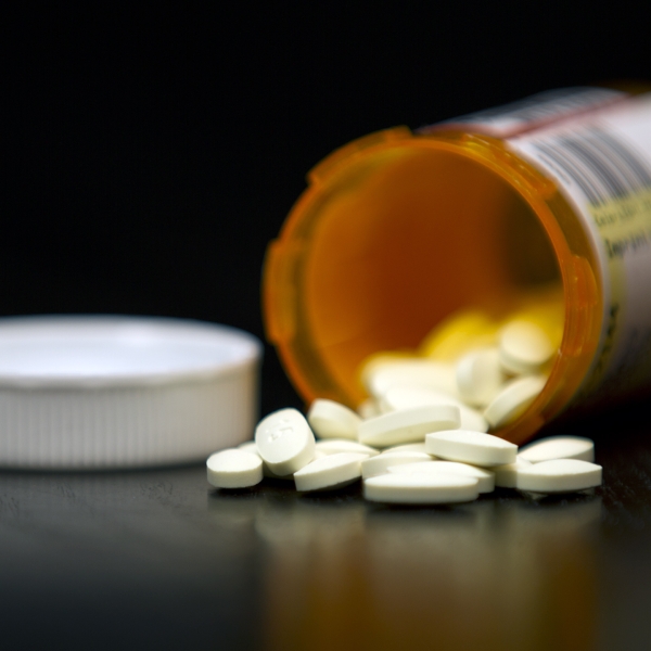 236454_Prescription_Drug_Bottle_open_with_numerous_pills_straight_on