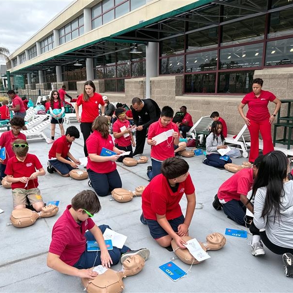Hands-Only+CPR+practice+at+swim+safety+event