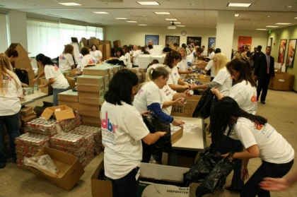 Dunkin’ Brands Employees Join Together to Stuff 3,000 Back Packs for The Greater Boston Food Bank