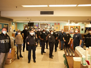 Evy Poumpouras and Dunkin’ deliver Box O’ Joe® cartons, donuts, and more to the NYPD.