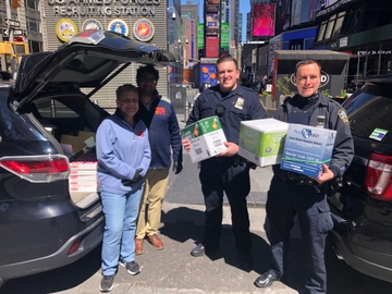 Franchisees Miten Patel and Caryn Battaglia donated over 36,000 pairs of plastic gloves to Manhattan South precinct delegates in Times Square.