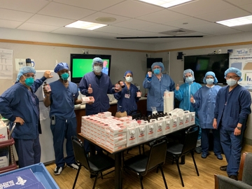 Medical Staff at the Long Island Jewish Medical Center receive a donation of Box O’ Joe® cartons and donuts from Evy Poumpouras and Dunkin’.