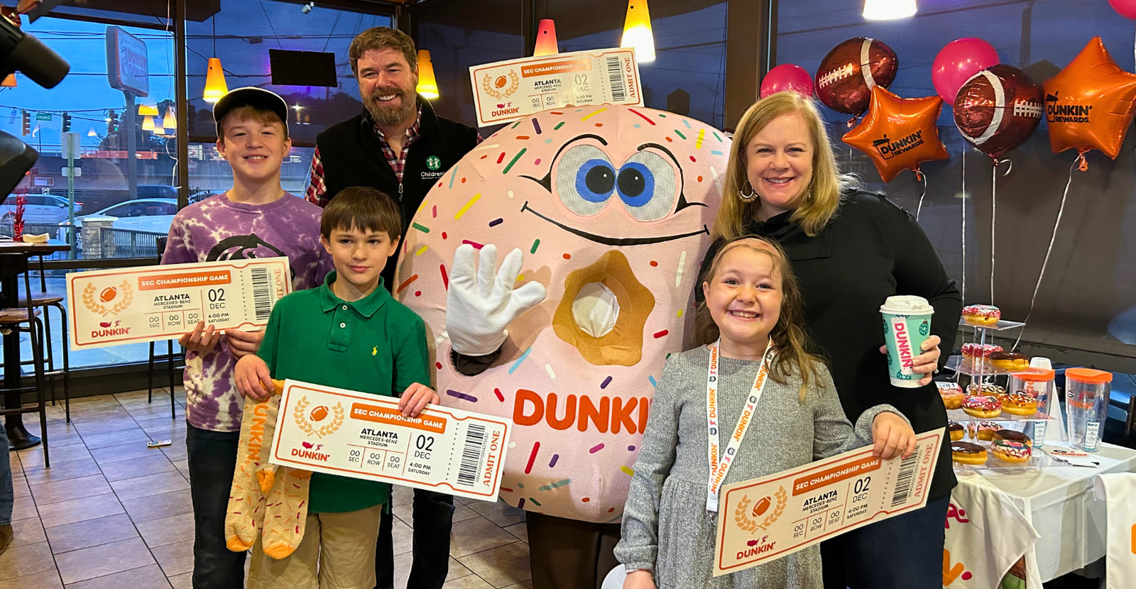 Dunkin’ Surprises Young Cancer Patient with VIP SEC Championship Game Experience
