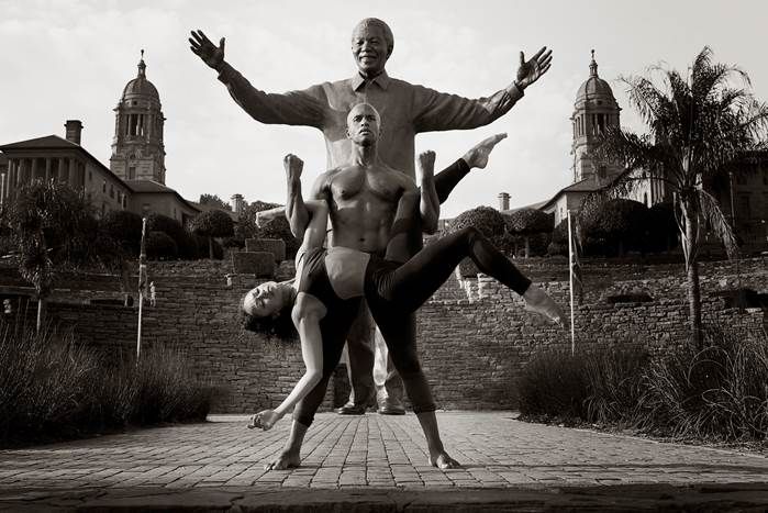 Former Ailey dancers Glenn Allen Sims and Linda Celeste Sims in front of Nelson Mandela Statue at the Union Building in Pretoria during the Company's Historic 2015 South Africa tour