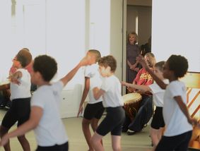 Elaine Wynn Watching The Ailey School's Ailey Athletic Boys in West African Class. Photo by Christopher Duggan. 