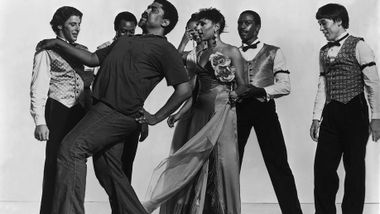 Alvin Ailey (front left) with company members including  Masazumi Chaya (far right) during a rehearsal of Donald McKayle's District Storyville. Photo by Jack Mitchell. (©) Alvin Ailey Dance Foundation, Inc. and Smithsonian Institution