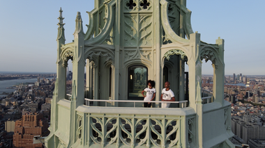 Ailey's Jacqueline Green and Yannick Lebrun at the top of The Woolworth Building. Photo by Mikey Pozarik
