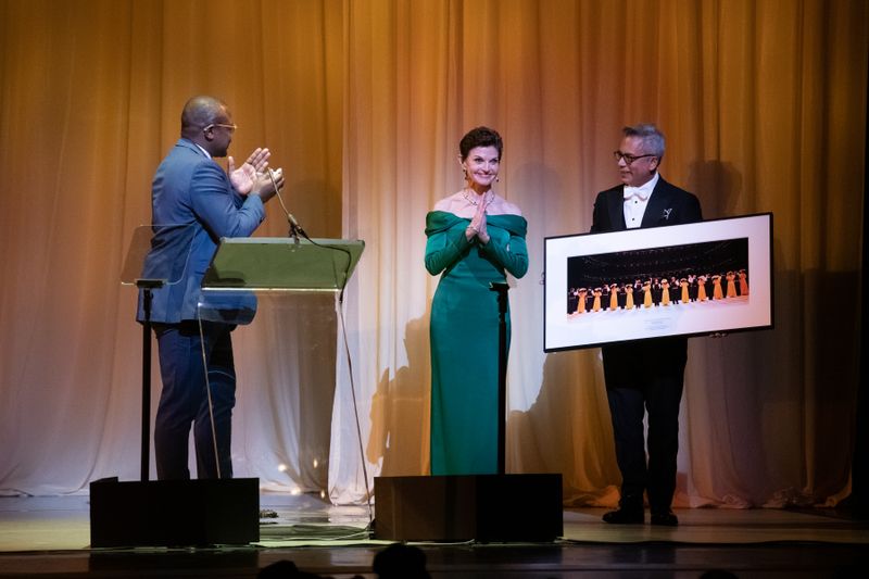 Artistic Director Robert Battle and Company Manager Gregory Stuart presenting Honoree Denise Littlefield Sobel's gift at Ailey's 2022 Opening Night Gala