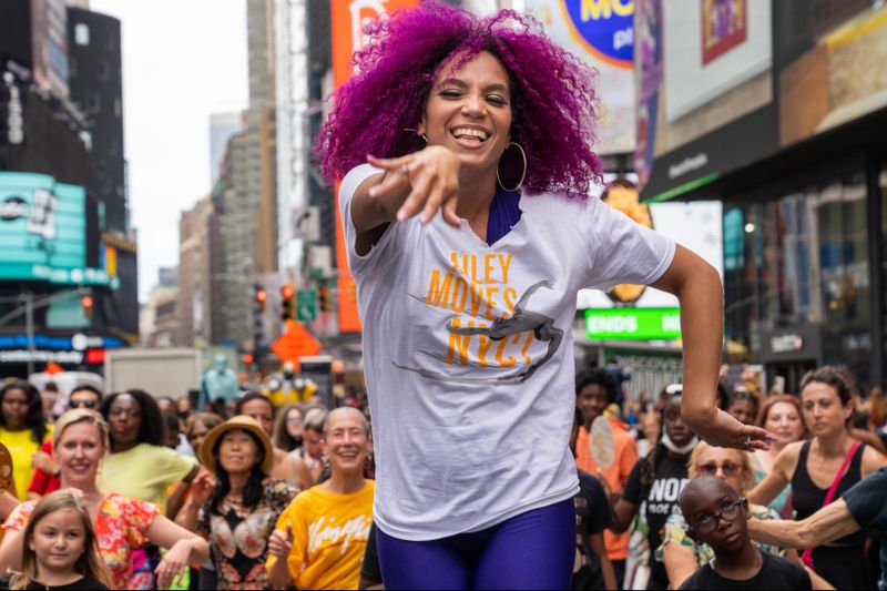 Ailey Extension's Katherine Jimenez leading NY Style Mambo in Times Square, AileyMoves NYC 2022