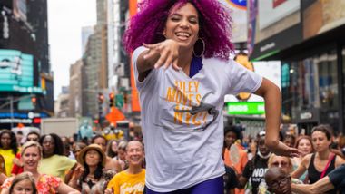 Ailey Extension's Katherine Jimenez leading NY Style Mambo in Times Square, AileyMoves NYC 2022