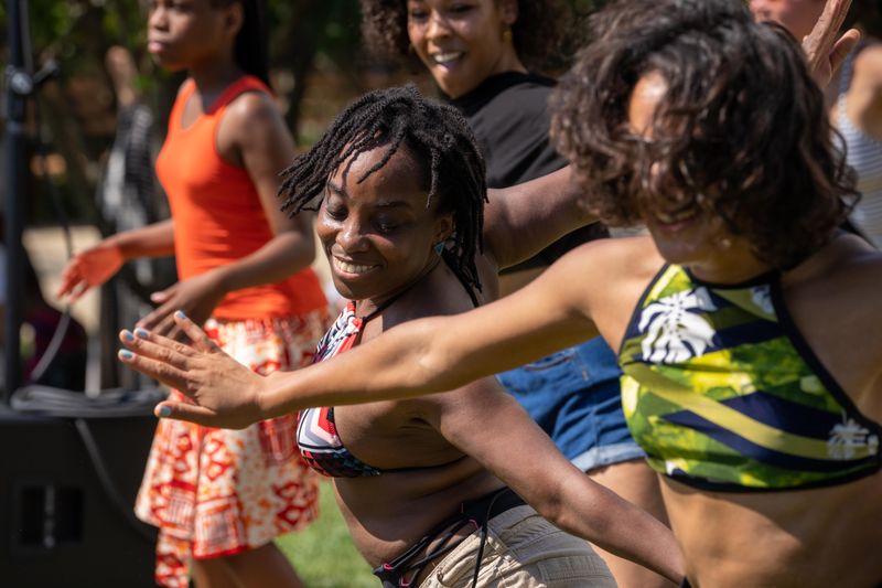 Guests participating in AIE's West African Workshop at Coney Island,  Ailey Moves NYC 2022