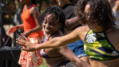 Guests participating in AIE's West African Workshop at Coney Island,  Ailey Moves NYC 2022