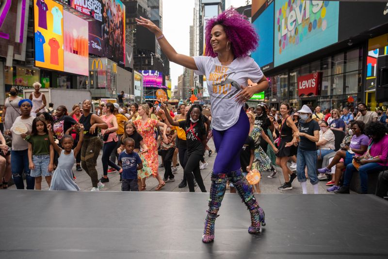 Ailey Extension's Katherine Jimenez leading NY Style Mambo in Times Square, Ailey Moves NYC 2022