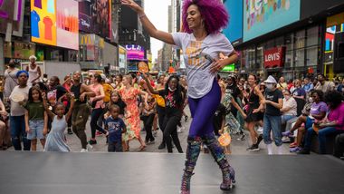 Ailey Extension's Katherine Jimenez leading NY Style Mambo in Times Square, Ailey Moves NYC 2022