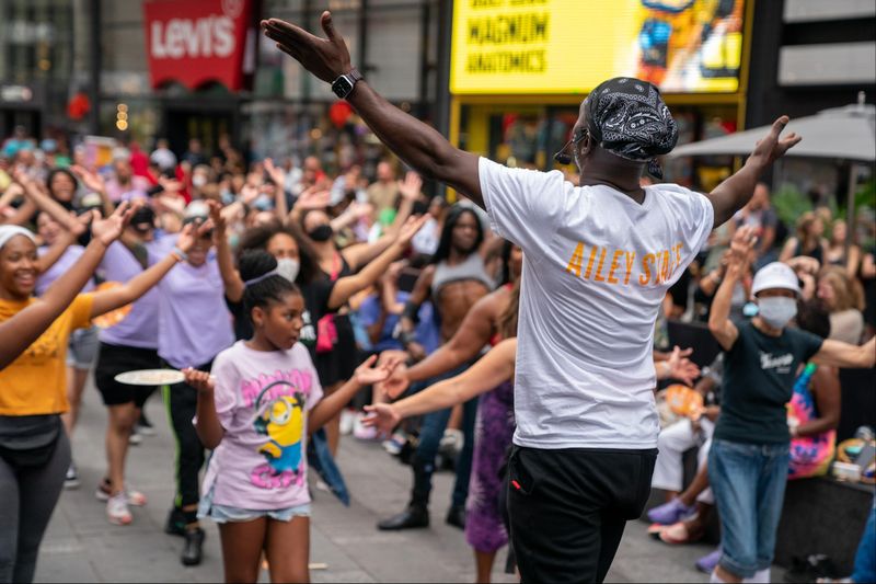 Ailey Extension's Maguette Camara leading West African in Times Square, Ailey Moves NYC 2022