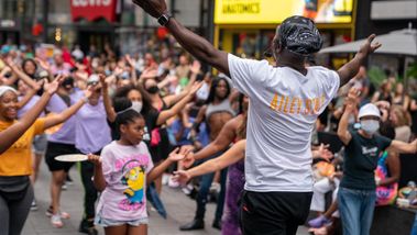 Ailey Extension's Maguette Camara leading West African in Times Square, Ailey Moves NYC 2022