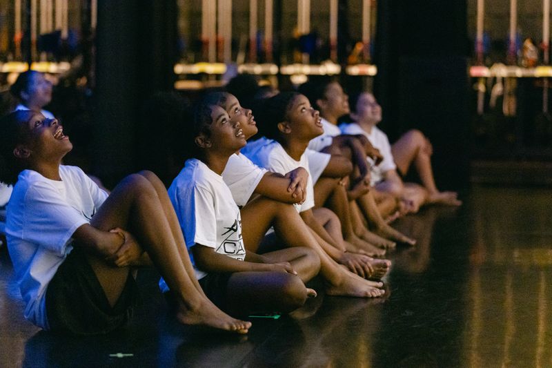 AileyCamp Newark participants watching a reflections video during the 2023 final performance
