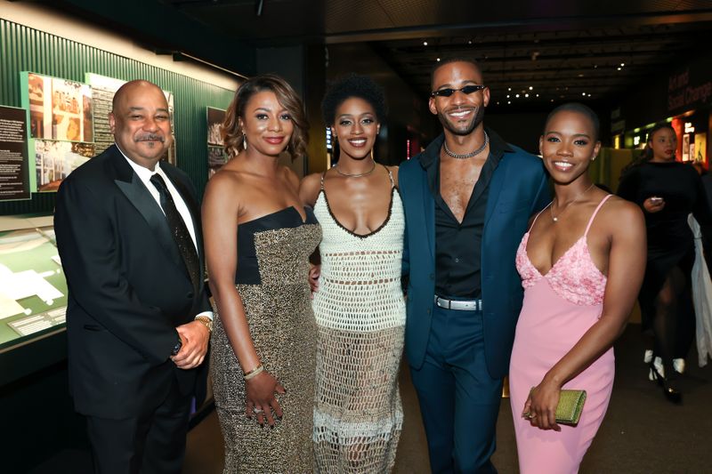 Ailey Board Members Tony Lewis and Sela Thompson Collins with members of Alvin Ailey American Dance Theater