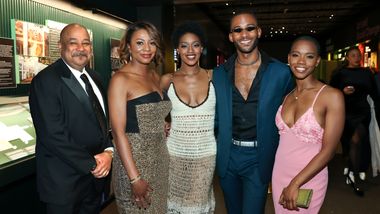 Ailey Board Members Tony Lewis and Sela Thompson Collins with members of Alvin Ailey American Dance Theater