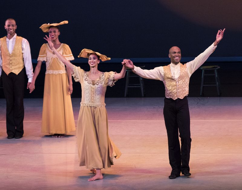 Former Ailey dancers Alicia Graf Mack and Antonio Douthit-Boyd bow after Alvin Ailey's Revelations