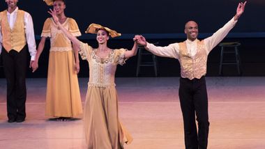 Former Ailey dancers Alicia Graf Mack and Antonio Douthit-Boyd bow after Alvin Ailey's Revelations