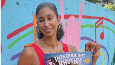 Alicia Graf Mack with her book, Introducing Rhythm
