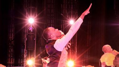 Alvin Ailey American Dance Theater's Tyrone Reese and company members in Alvin Ailey's Revelations. Photo by Xavier Mack