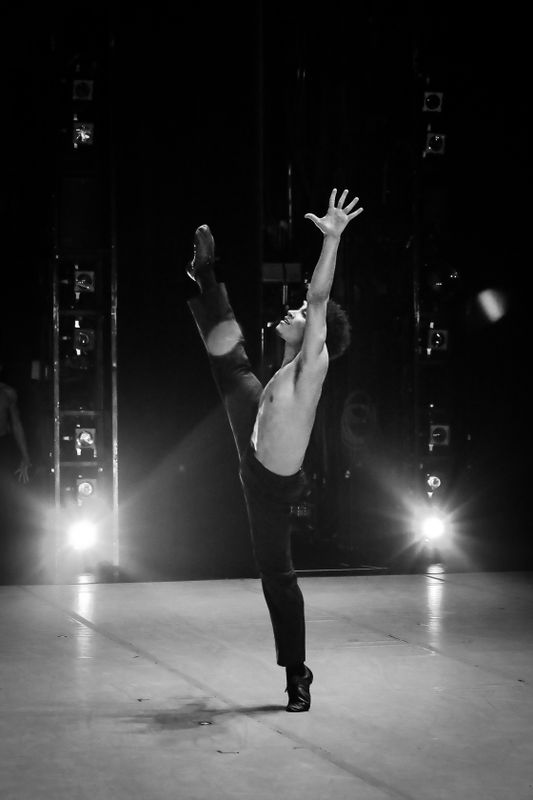 Alvin Ailey American Dance Theater's Mason Evans in Alvin Ailey's Revelations. Photo by Xavier Mack