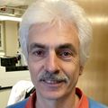 Jacob Raber, Ph.D., a man with white hair, a gray mustache, smiling.