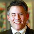 smiling man, wearing suit