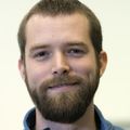 close-in headshot of Andrew Adey, Ph.D., a bearded, brown-haired man