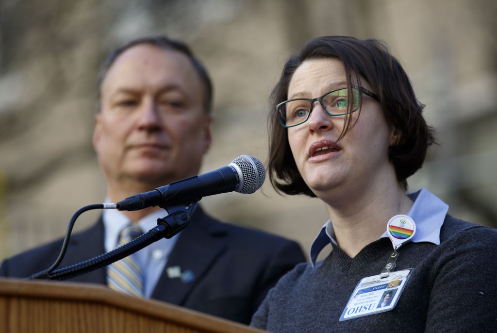 woman speaking at podium
