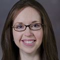 dark haired woman smiling at camera