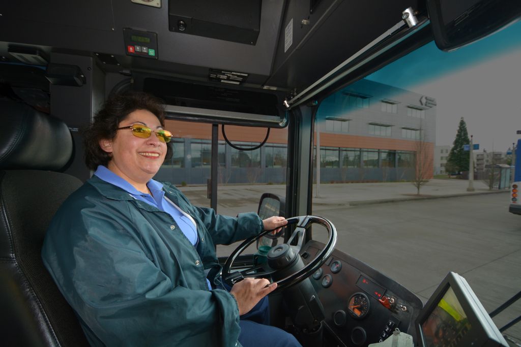female bus driving, driving a bus