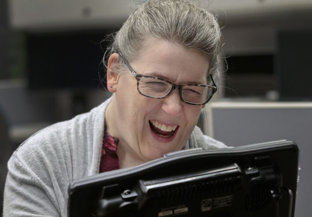 Woman typing on keyboard