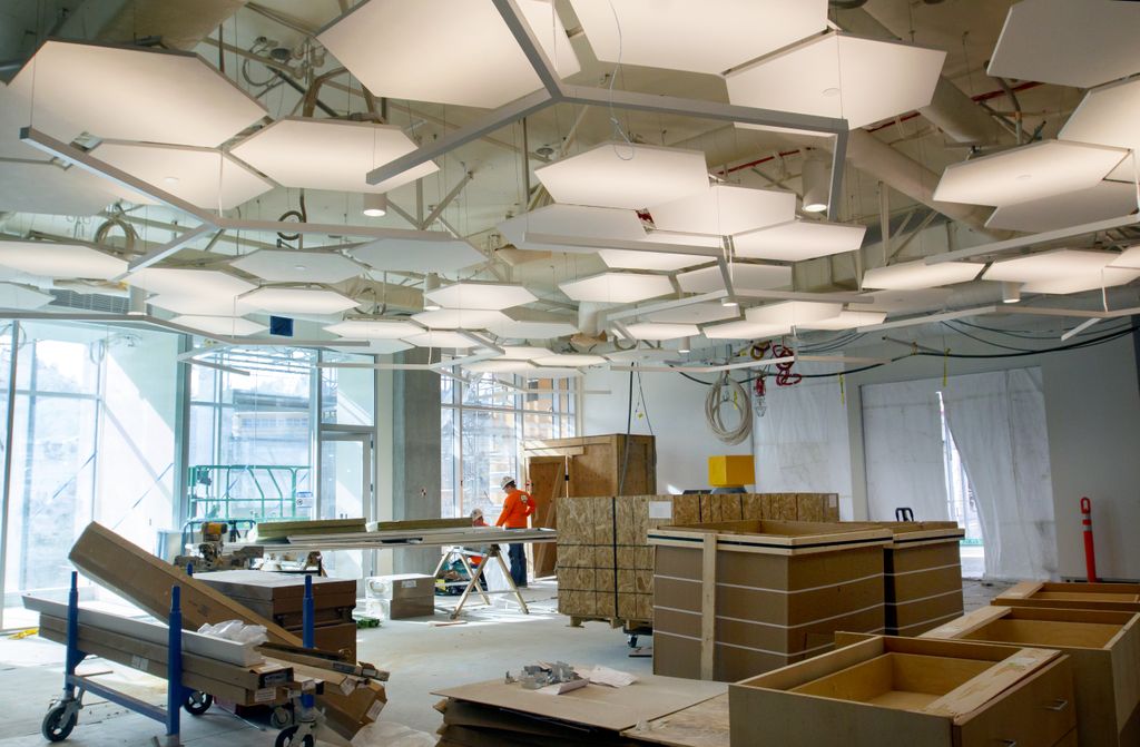 room under construction, with large walls of glass