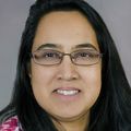 woman with long dark hair, glasses
