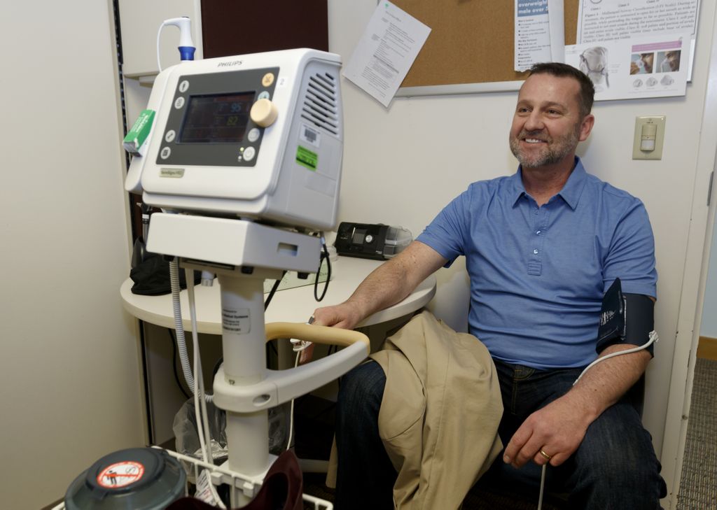 man getting his blood pressure checked