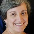 woman smiling, short gray hair