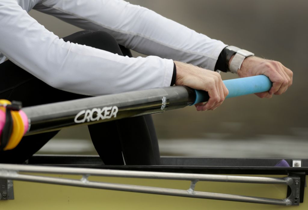 closeup of vogt's hands on the oars