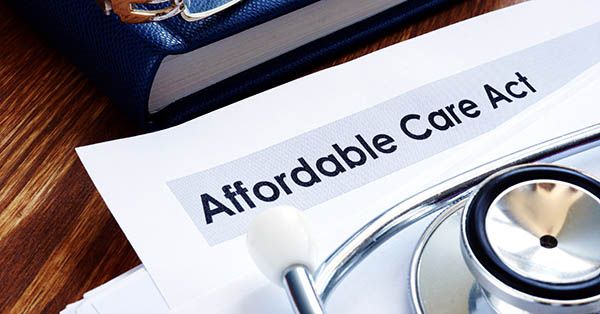 Affordable care act ACA or Obamacare and stethoscope.
