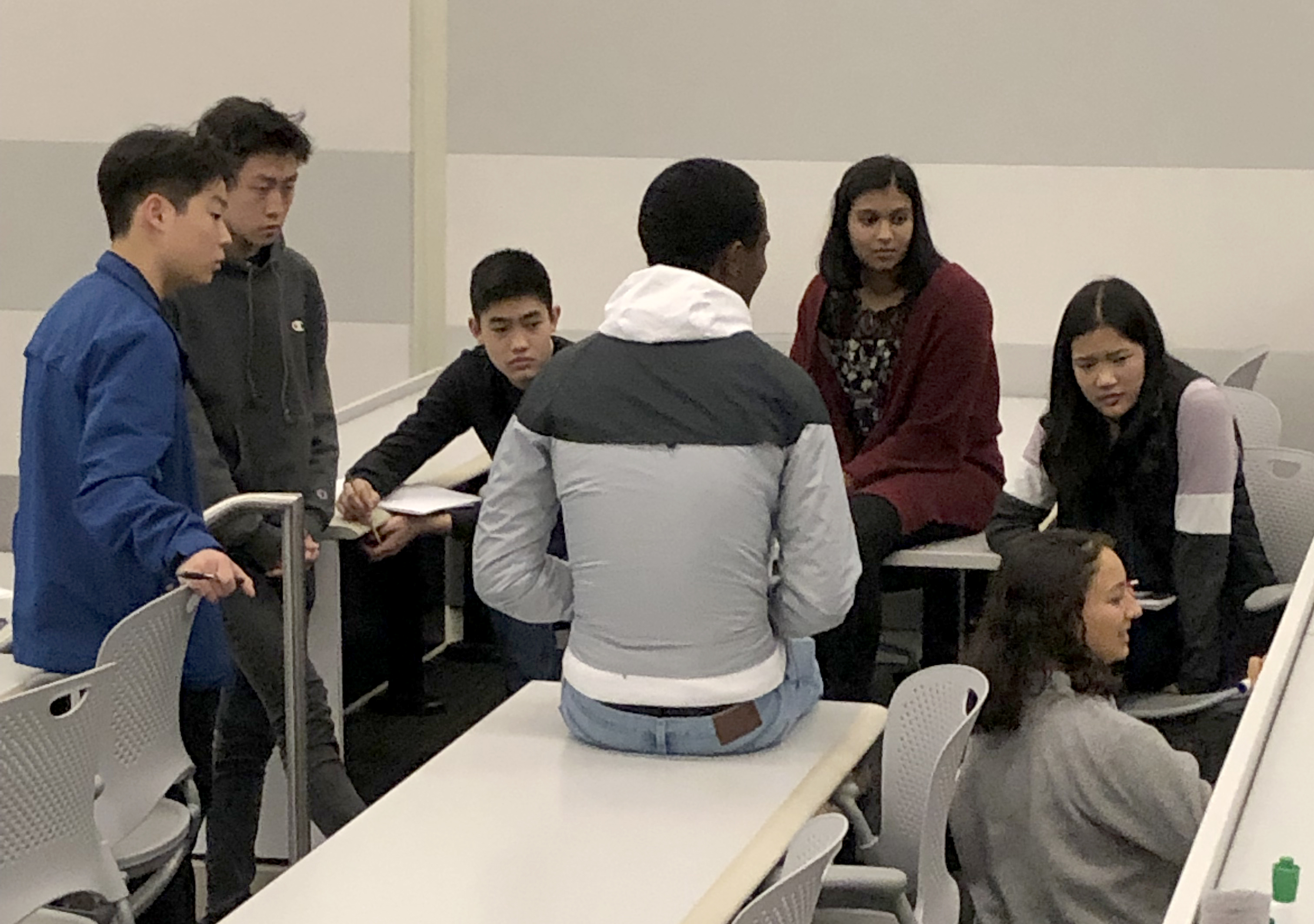 PSI students discussing research
